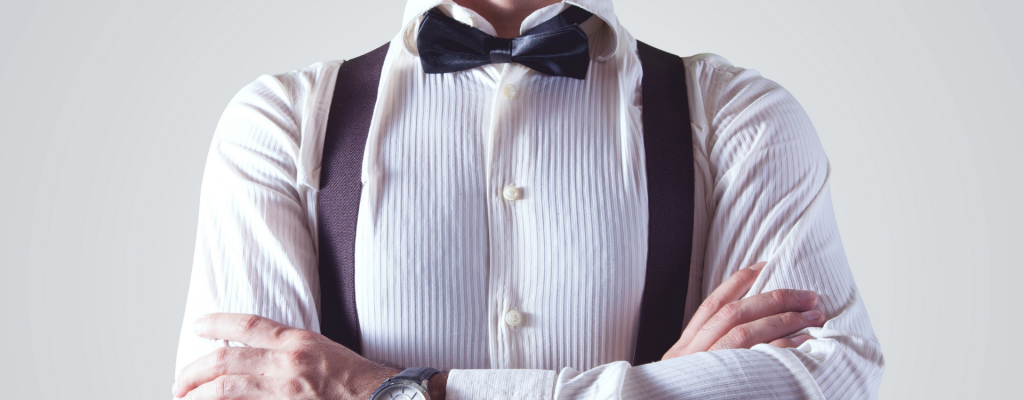 workplace bully | Torso of a well dressed man with arms crossed